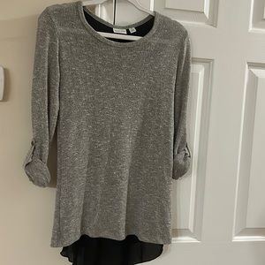 Cute quarter length sleeve top with even cuter back details!